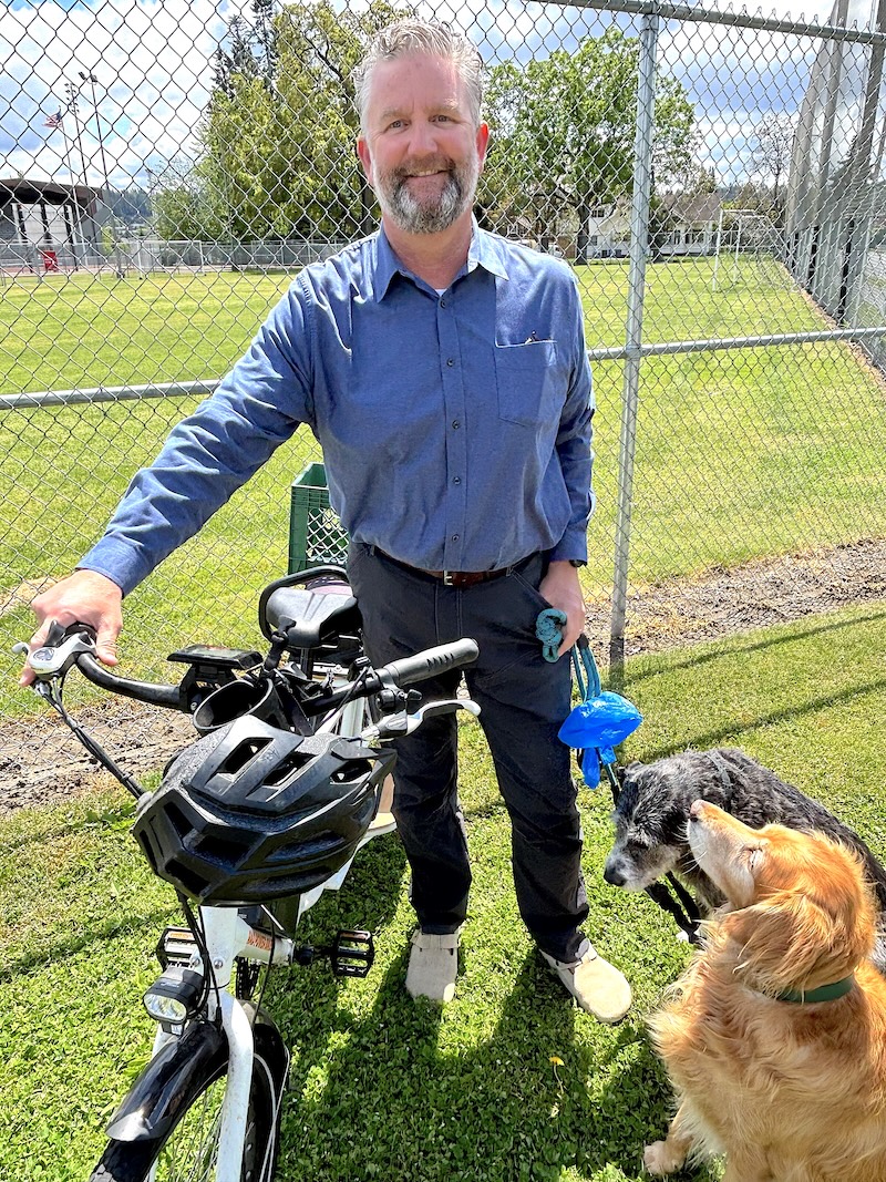 Jeff Bennett with dogs and bike near Sparks Stadium
